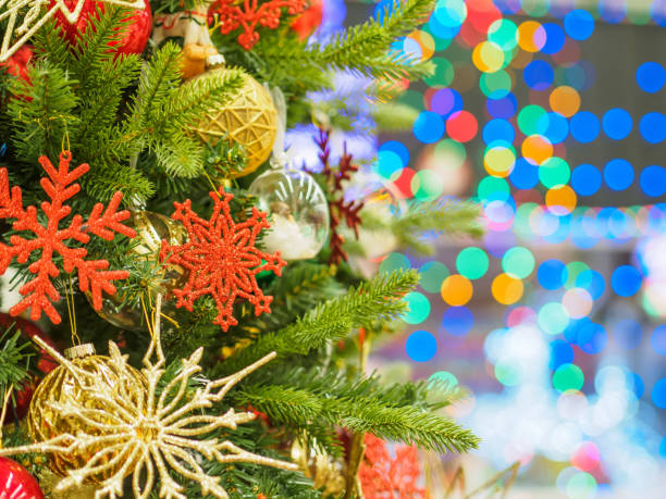 istock Bright and beautifully decorated with toys Christmas tree against shiny illuminated soft focused background. Christmas and New Year concept. 892394854