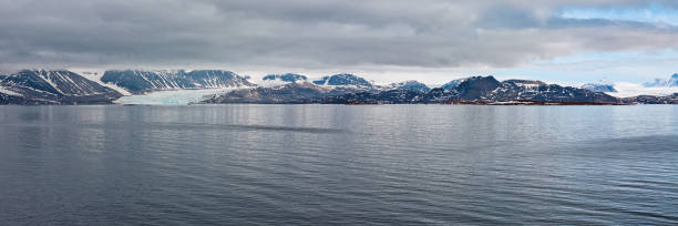 istock Mountain range and glacier in Svalbard islands 892394942