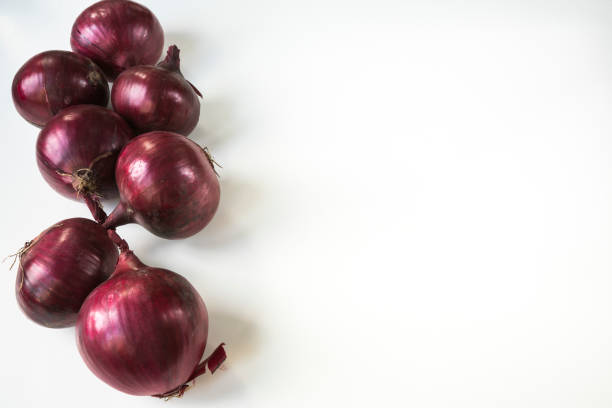 close up onions on white table