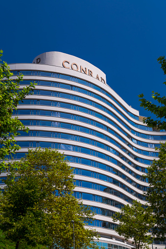 Istanbul, Turkey - August 25, 2017: The curved building of Conrad Istanbul Hotel, located at the Barbaros Boulevard in Besiktas, Istanbul.