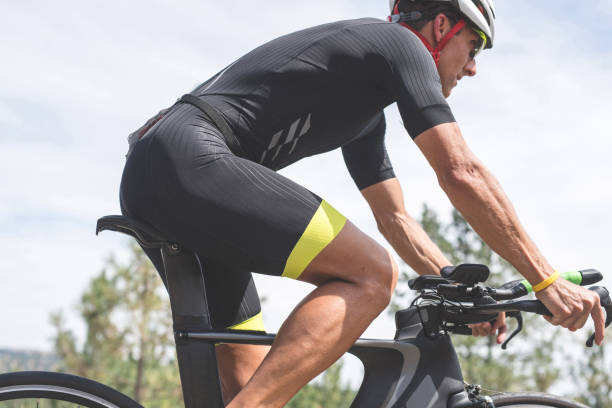 istock Triathlete cycling on a bicycle 892420288