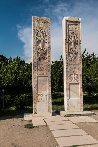istock Stone cross in Echmiadzin (Vagharshapat) made of red stone tufa. , 892422980