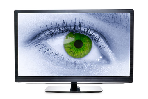 Wide screen TV with toned eye on the screen. Isolated on white