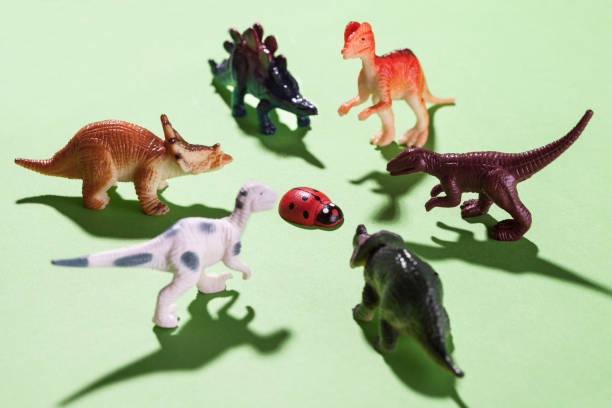 istock Dinosaur toys and ladybug 892438674