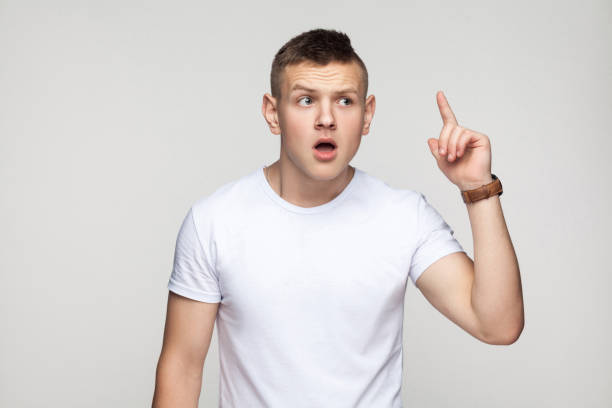 istock Young gay finger up and have a idea 892443340