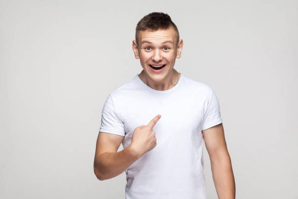 istock Happiness boy looking at camera and pointing finger himself. 892443344