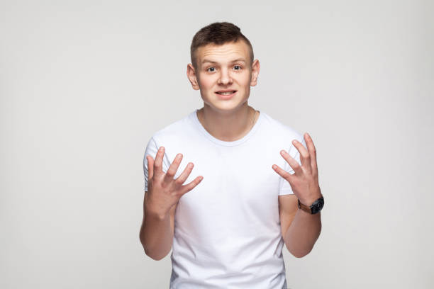 istock Enrages young boy looking at camera and say why or how? 892444146