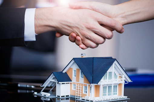 Making real estate deal, handshake with agent