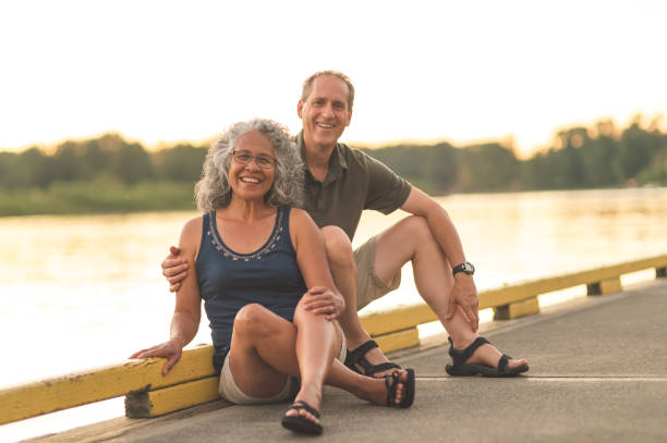 istock Smiling ethnic elderly woman kayaking with her husband 892455116