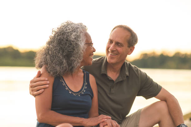 istock Smiling ethnic elderly woman kayaking with her husband 892455126