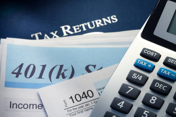 istock A Calculator On Top Of 401k Statement And Tax Return 892455228