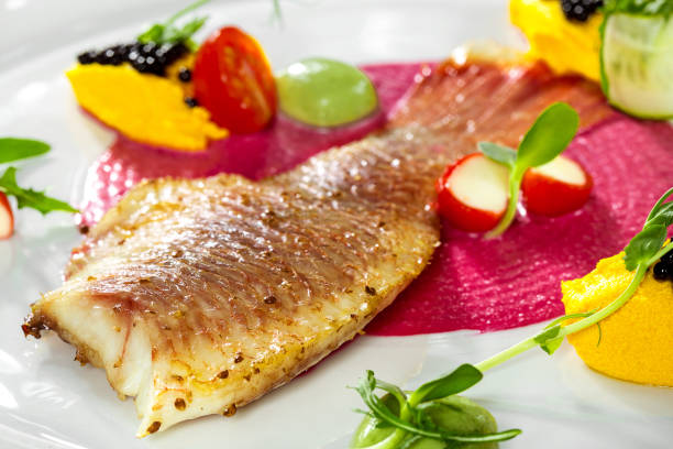 istock Fish dish - fried fish fillet and vegetables 892457832