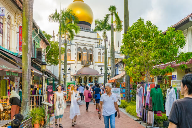 Visitors walk around Masjid Sultan at Mosque street in Singapore Singapore - September 2, 2017: Visitors walk around Masjid Sultan, The mosque is considered one of the most important mosques in Singapore kampong gelam stock pictures, royalty-free photos & images