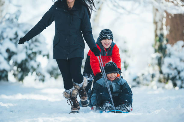 istock Snowy playground with mom! 892460650