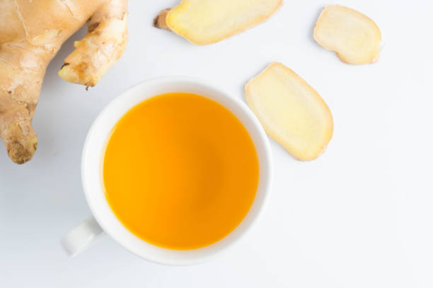 istock hot ginger tea ginger ale ginger beer in glass with ginger slice on white background 892471720