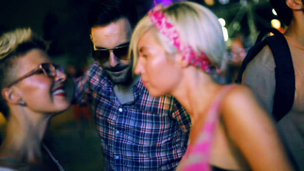 istock People dancing on music festival 892478198