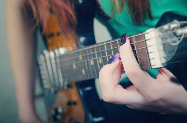 girl playing the guitar