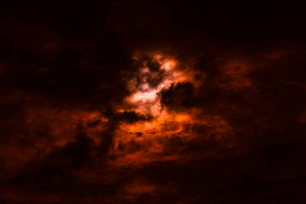 istock Wildfire sky with smoky black and red clouds, nature abstract background. 892499310