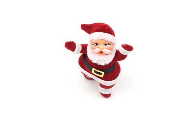 istock santa claus dolls on white background 892502224