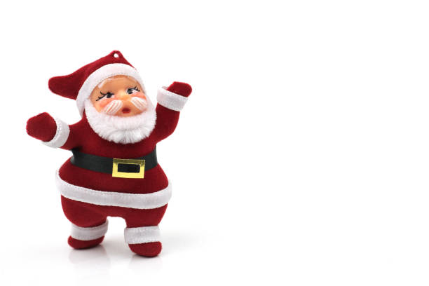 istock santa claus dolls on white background 892502232