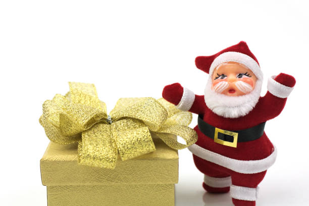 istock Santa claus doll and gift box  isolated on white background 892502240