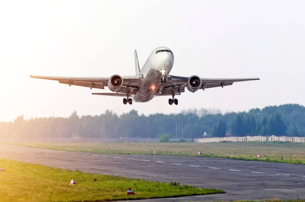 istock Passenger airplane take off at sun on a runway. 892505282