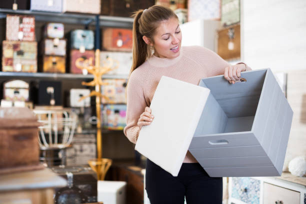istock Woman choosing wooden box 892507766