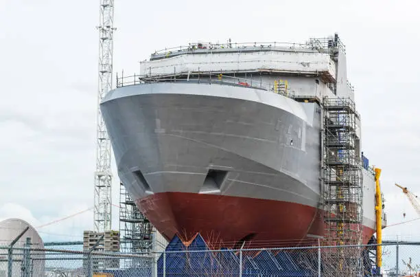 A naval vessel nears completion.