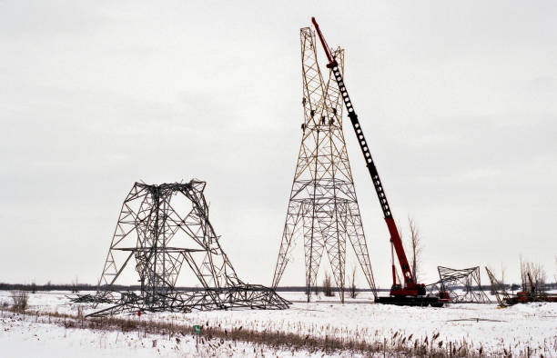 Fallen hydro towers, under reconstruction after the famous 1998 ice storm, in eastern Canada. stock photo