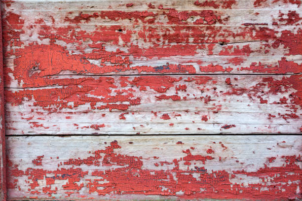 Historic door panel, red painted peeling board