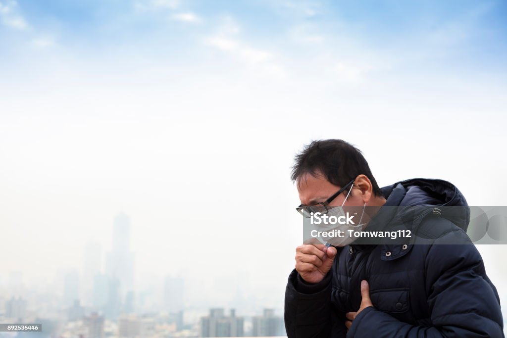 Lung cancer patients with smog city background Adult Stock Photo