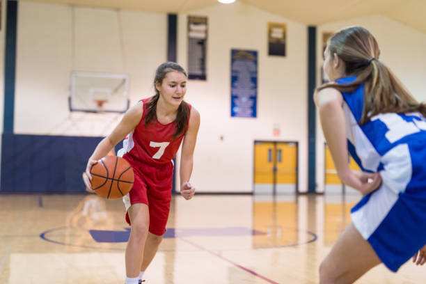 istock Action-Packed Girl's High School Basketball Game 892536498