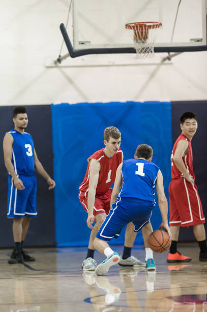 istock Action-Packed Boy's High School Basketball Game 892536502