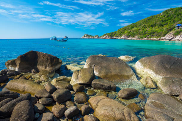 istock Rock beach and blue sky with beautiful clouds tropical sea 892536784