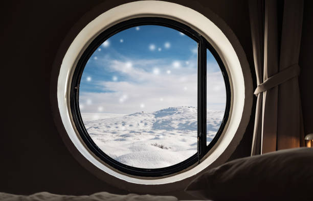 istock Looking through window in winter, snowdrift with snow fall in winter. Christmas morning 892542148