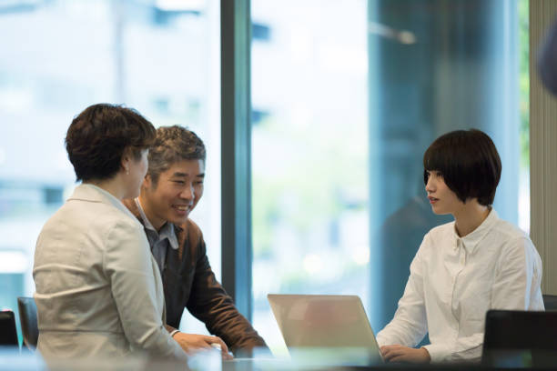 istock Various age Asian business team are meeting around the table 892550670