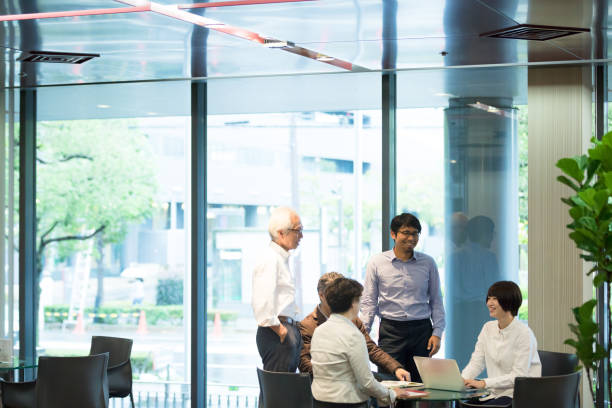 istock Various age Asian business team are meeting around the table 892550704