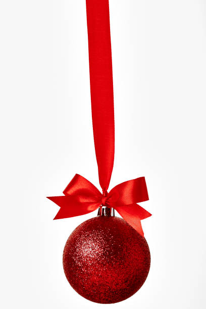 istock Red christmas ball with red bow over white 892553544