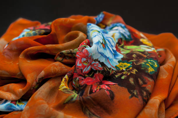 istock Color orange textil, silk fabric with pleats 892564946