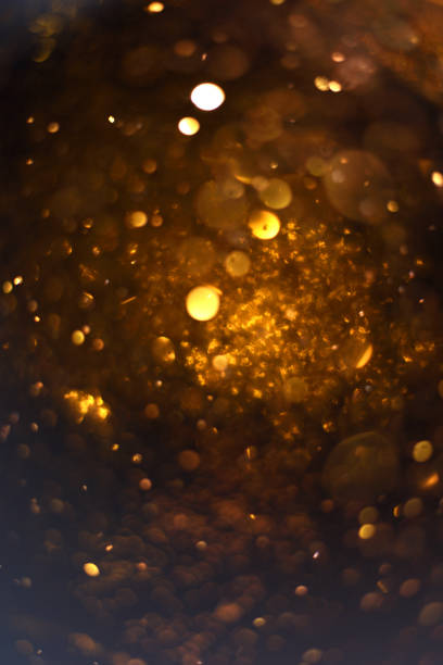 istock golden glitter texture Colorfull Blurred abstract background for birthday, anniversary, wedding, new year eve or Christmas. 892565344