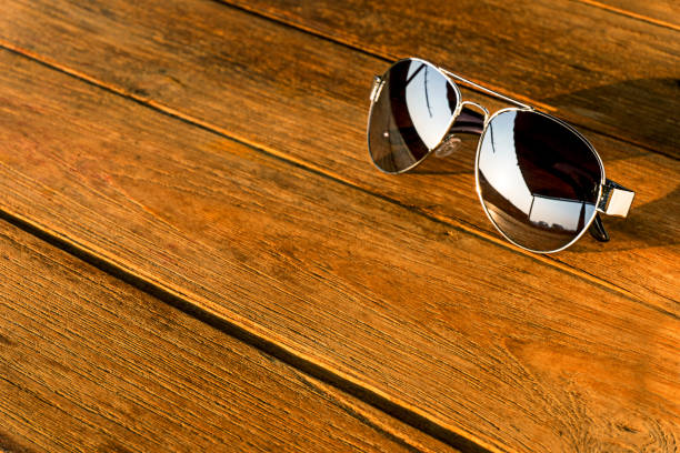 istock the sliver sunglasses is on the wood table, 892573814
