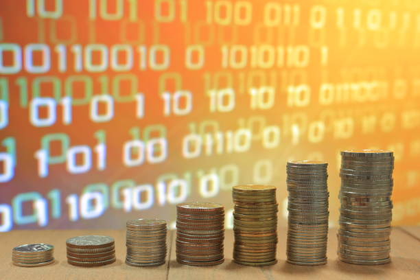 istock financial data information value digital business concept  Digital economy. Coin stack increasing chart shape with orange light and binary digital numbers background. Business, finance and saving concept. 892576250