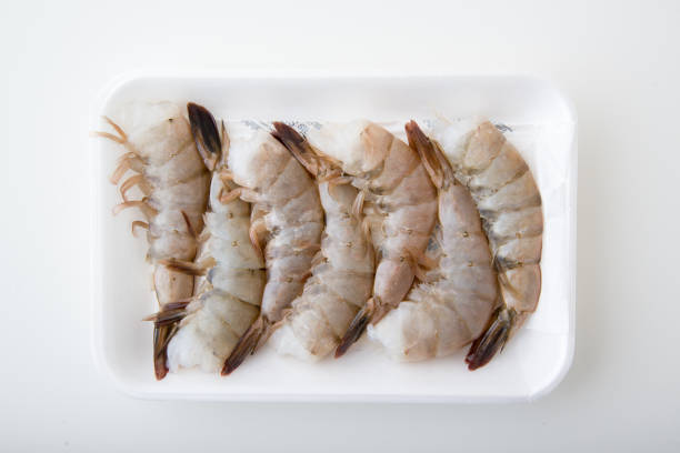 istock isolated black tiger shrimp in plastic tray 892578956