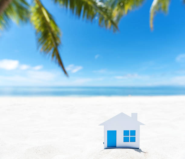 istock Small house on the tropical white sandy beach 892585424