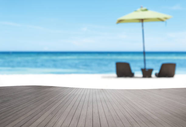 istock Wooden terrace beside summer tropical beach 892588828
