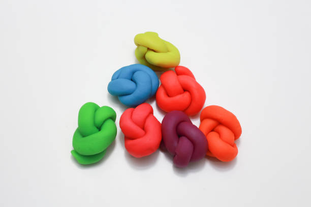 istock colorful playdough close up image on white background. 892599616