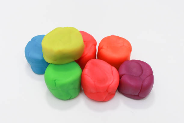 istock colorful playdough close up image on white background. 892601856