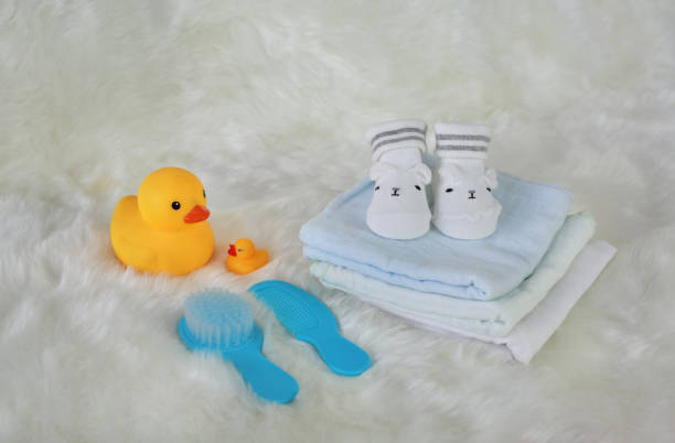 istock Collection of items for newborn babies on white fur. 892611454
