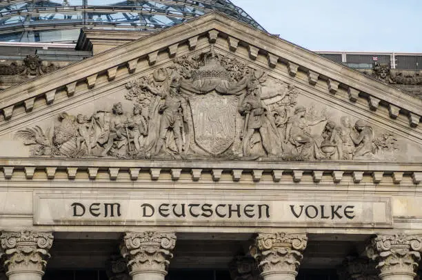German parliament building (Reichstag) in Berlin, Germany with writings that mean "The German People".