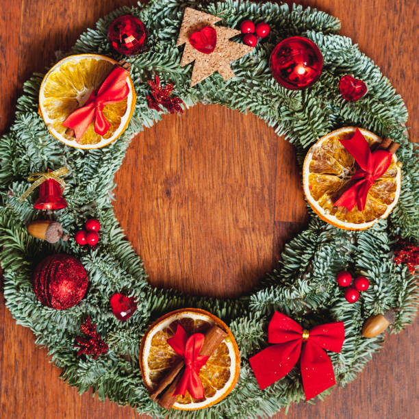istock Beautiful Christmas wreath on wooden background 892620090